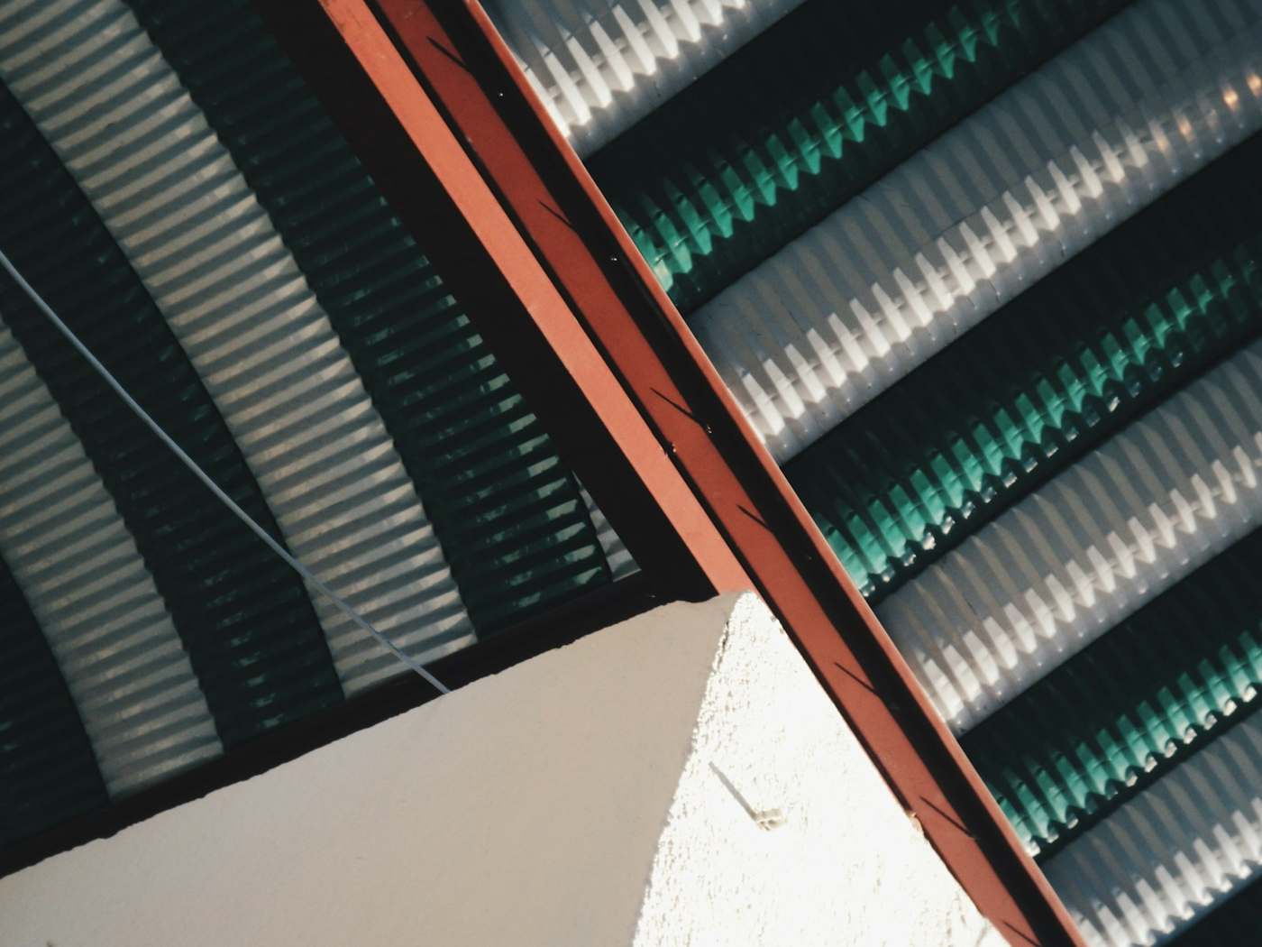 Corrugated long-run steel roof and a coloured flashing line
